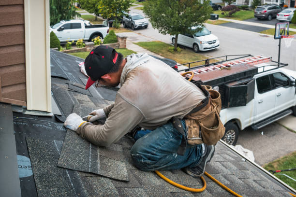 Professional Roofing technician working in Albertson, NY